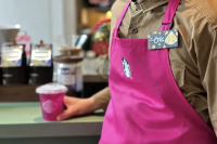 What does Starbucks pink apron stand for? Does Pink Drink have caffeine?