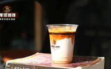 What proportion is authentic latte made in Caffè Latte? How much milk does a coffee shop latte take?