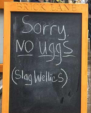 Coffee shops in London banned customers from wearing snow boots as toes unwilling to apologize for the new slogan.
