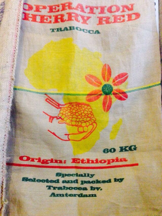 How do you understand the words on the sacks of raw coffee beans packed with information about coffee beans?