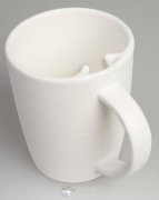 A coffee cup that hugs a spoon