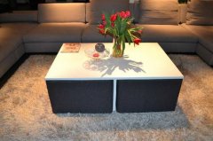A simple coffee table with its own chair. Want to own it?