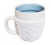 A coffee cup in a sweater