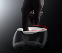 Stirring the coffee cup with fingers designed a soft lid in the middle for the coffee cup.