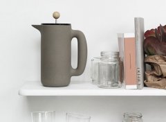 The French press is a tall, thin glass cylinder with a piston fitted with a filter