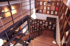 A cafe surrounded by books: a half-story bookstore