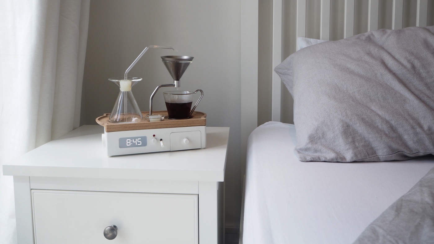 A coffee alarm clock that lets the smell of coffee lure you up and wakes you up while making coffee