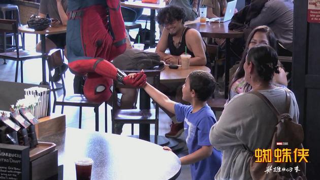 Spider-Man showed up at Starbucks to buy coffee, scaring a bunch of onlookers.