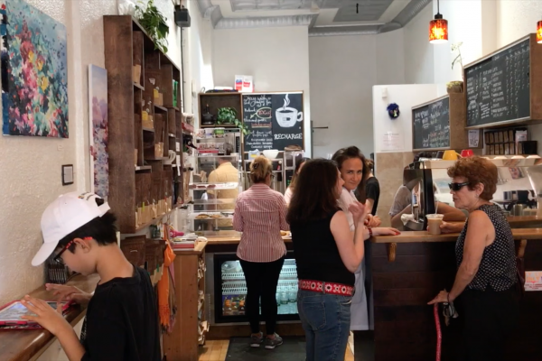 Coffee shop clerks do business on group holidays with the help of neighbors.