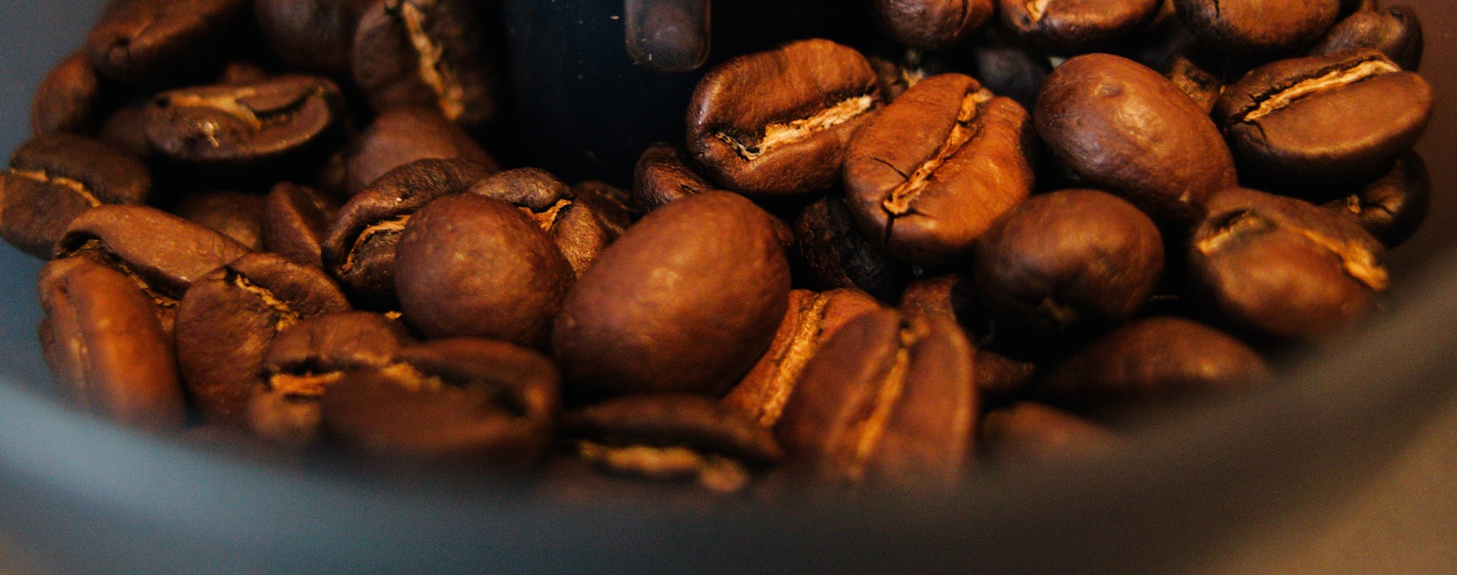 Don't be silly. The coffee shop owner doesn't have time to pick beans from you.