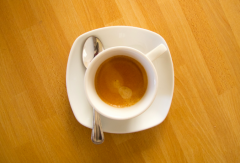 Why do you give an espresso a cup of water? what kind of cup should you use to drink it correctly?