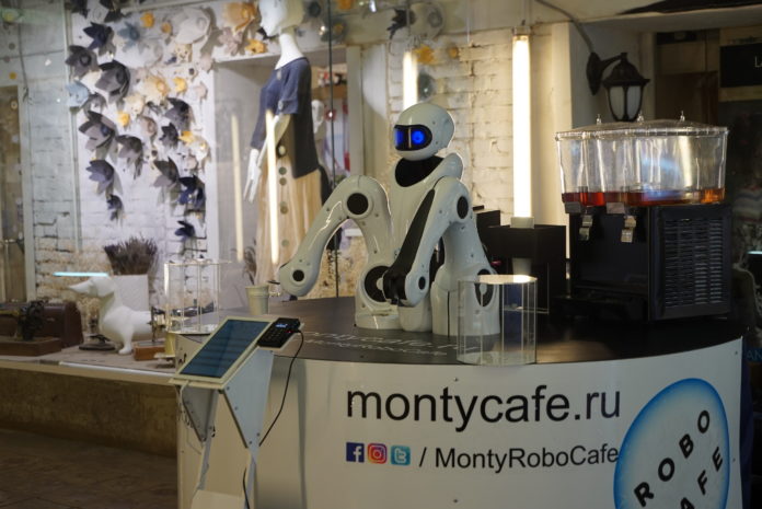 Combat national robot barista shows up! Two cups at a time with both arms! Will take up his post in Moscow
